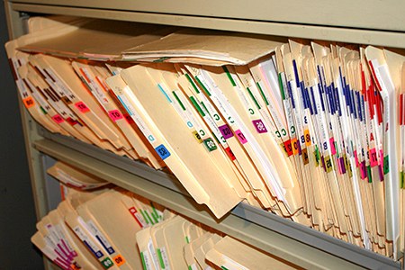 Filing cabinet filled with manilla folders