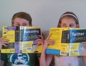 Photo of two children holding podcasting for dummies and twitter for dummies
